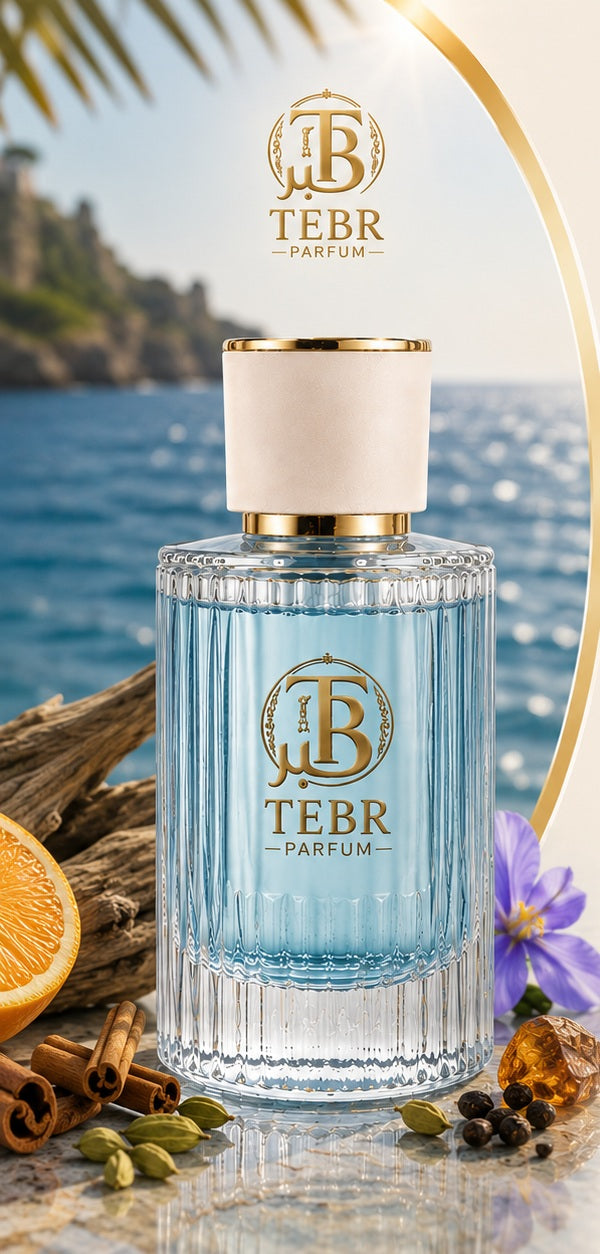 TEBR Blue Waves eau de parfum bottle in pale blue glass by the sea